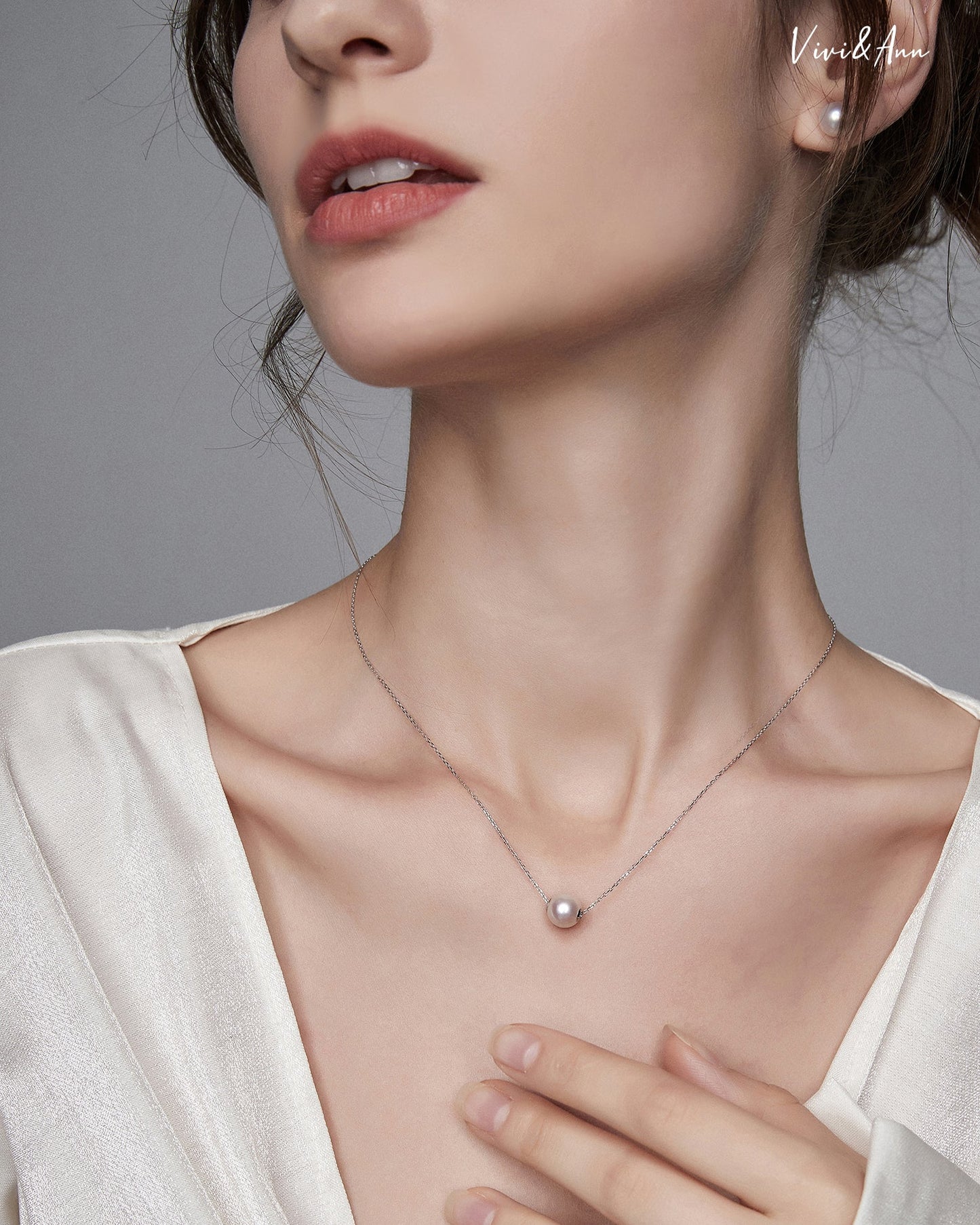 Lady wearing single Akoya pearl necklace